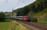 Re 4/4 II 11204 mit Interregio am 28.06.2011 bei Tecknau