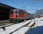 Re 4/4 II 11111 mit dem RE 3811 bei Einfahrt in Landquart.