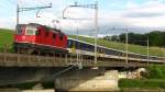 Re 4/4 II 11128 mit Arbeiterzug Zrich HB-Arth Goldau bei Oberrti am 20.06.2011 