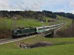 Die Re 4/4 11161 mit einem Voralpenexpress am 23.04.2012 unterwegs bei Biberbrugg.