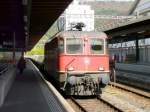 SBB - Re 4/4  11328 vor Gterzug bei der durchfahrt im Bahnhof Biel am 27.04.2012