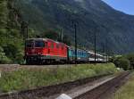 Die Re 4/4 11223 mit einem IR am 26.06.2011 unterwegs bei Erstfeld.