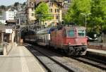 Da wurde ich 2x berrascht: Die Re 4/4  11244 durchfhrt am 28.06.12 mit einem NDW B und 2 Sps den Bahnhof Montreux mit dem Ziel Villeneuve.