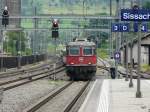 SBB - Re 4/4 11124 mit RE bei der einfahrt im Bahnhof Sissach am 28.07.2012