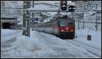 EC114 mit Re 4/4 II 11201 verlsst den Gotthard Tunnel in Gschenen.