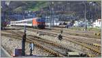 IR1175 nach Chur mit Re 4/4 II 11214 verlsst Sargans. (19.03.2013)