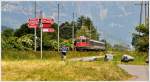 Der ALTE RHEINTALEXPRESS zwischen Sevelen und Weite. Die Re 4/4 II 11135 zieht den RE3815 nach Chur. (08.06.2013)