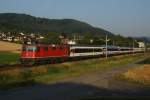 Re 4/4 II 11215 zieht am 21.07.2013 den IR 2163 von Itingen Richtung Sissach.