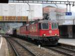 SBB - Re 4/4  11328 + Re 6/6 mit Güterzug bei der durchfahrt im Bahnhof Arth-Goldau am 05.04.2014