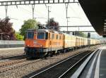 SBB - Re 4/4 11320 mit Postzug bei der durchfahrt in Rupperswil am 25.04.2014