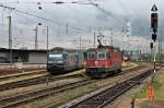 Nachschuss auf SBB CFF FFS Re 4/4 11240, als sie als Lokzug die BLS Cargo Loks Re 465 008-1  GoldenPassLine  und Re 465 014-9 im Badischen Bahnhof von Basel passiert.