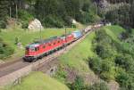 A pair of SBB locomotives (11668 leading) haul a southbound intermodal train past Wassen, 15 August 2014