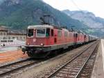 SBB - Re 4/4 11287 und Re 4/4 11352 und Re 4/4 11232 vor Güterzug im Bahnhof Erstfeld am 01.08.2015