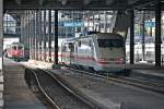 Wärend 401 590-5 am 25.10.2014 als ICE ___ (Interlaken Ost - Berlin Gesundbrunnen) in den Bahnhof von Basel SBB fährt, steht ein Bahnsteig links neben dran die ex. Swiss Express Re 4/4 11133 mit einem IR (Basel SBB - Locarno) und wartet auf die Ausfahrt.