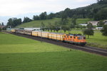 Die Re 420 320  Interregio Cargo  fährt am 27.06.2015 mit dem am jeden Samstag Abend fahrenden Postzug nach Frauenfeld durch St.Margrethen.