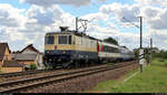 Re 4/4 II 11387 (421 387-2) der International Rolling Stock Investment GmbH (IRSI) als DPE 31469 von Neustrelitz Hbf nach Konstanz fährt mit verschiedenen Personenwagen in Zscherben, Angersdorfer