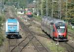 Der Bahnverkehr in Lindau ist nicht nur bunt sondern auch international: die Deutsche 223 061 fährt zu ihrem Alex, daneben erreicht eine österreichische Ente ihren Zielbahnhof und im Hintergrund wartet die SBB Re 421 343-2 auf den EC von München. 
9. September 2009  