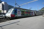 Die Re 460 099 mit der Gottardo 2016 / Die Mobiliar Werbung am Morgen des 16.7.2016 im Bhf Brig.