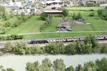 Re 460 031 mit Werbung für den Ceneri Basistunnel am 23.7.18 mit einem IC 8 kurz vor Brig, aufgenommen von der Südrampe.