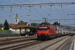 Re 460 099-5 durchfährt den Bahnhof Rupperswil.