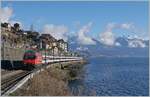 Gut 25 Jahre später ist erneut eine SBB Re 460 mit einem Schnellzug bei St-Saphorin auf dem Weg nach Lausanne, der  Schnellzug  heisst nun IR90 und besteht aus EW IV Wagen.