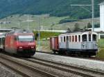 tpc - ( 100 Jahre AOMC ) Fahrzeugparade mit dem Oldtimer Triebwagen BCFe 4/4 6 und dem Gterwagen K 65 unterwegs unterwegs bei Aigle und mit der SBB 460 004-5 die mit einem Schnellzug unterwegs nach