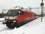 Die Re 460 097-9 an der Spitze des IC 835 in Visp, 07.12.2012.