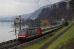 Re 460 036-7 zieht am 18.01.2014 den IR 1719 von Montreux Richtung Brig, aufgenommen bei Veytaux-Chillon.