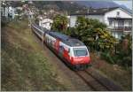 Die SBB Re 460 048-2 erreicht mit ihrem IR 2421 von Zürich kommend, in Kürze Locarno.