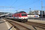 SBB Re 460 065-6  Coop Pro Montagna  durchfährt mit einem Probe-/Messzug, bestehend aus einem Messwagen und ein Bt-Steuerwagen, den Bahnhof Zürich Oerlikon.