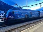 Die Re 460 078 mit  Nendaz  Vollwerbung steht am 19.2.24 im Bahnhof Brig.