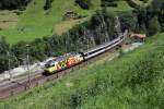 Re 460 053 mit einem IR am 27.06.2011 auf der Gotthard Strecke bei Wassen.