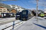 Der neue Niederflurwagen 271-0, die GPX Komp 3  Gstaad  mit der Komp 2  Interlaken  und der Re 465 008 mit der GPX Komp 4  Shania Train  am 26.11.23 im Bahnhof Zweisimmen.