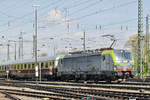 Re 475 404-0 fährt beim Badischen Bahnhof ein.