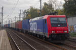 482 043-7 zieht einen Containerzug zu den Hamburger Hafen durch Hamburg Harburg.