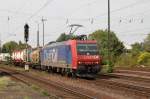 482 028-8 der Gesellschaft  ChemOil  mit Containerzug bei der Durchfahrt in Ludwigshafen-Oggersheim Richtung Mannheim.