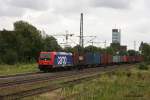 482 038 mit einem Containerzug nach Hamburg Waltershof in Hamburg Unterelbe am 10.08.2011.