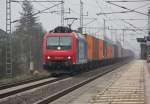 Ein Gterzug auf der Schnellfahrstrecke? 482 033  Basler Rheinhfen  kam am 17.03.2012 mit Containerzug auf der SFS in Richtung Wunstorf durch Dedensen-Gmmer.