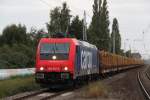 482 042-9 Mit Holzzug von Rostock-Bramow nach  Borstel(Kr.Stendal)bei der Durchfahrt im S-Bahnhof Rostock-Holbeinplatz,Ab Borstel bernimmt dann die PRESS den Zug bis   Stendal-Niedergrne.16.09.2012 