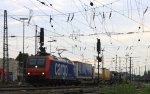 482 002-3 von der SBB Cargo fhrt mit einem Containerzug aus Antwerpen-Oorderen(B) nach Gallarate(I) bei der Ausfahrt von Aachen-West und fhrt in Richtung Aachen-Hbf,Kln in der Abendsonne und Wolken