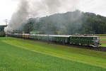 Ae 6/6 11407  Aargau .
Westschweiz-Rundfahrt Eurovapor.
Die Die Kantonslok Ae 6/6 11407  Aargau  als Heizlok auf der alten Strecke bei Wynigen in strömendem Regen und bei sehr schlechten Lichtverhältnissen am 3. Oktober 2020.
Als Allwetterfotograf lasse ich mir natürlich solch einmalige Fotosujets nicht entgehen. Die Bahn ist ja schliesslich bei jedem Wetter unterwegs.
Foto: Walter Ruetsch