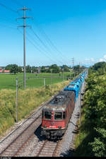 Re 6/6 11643 mit Kieswagenleerzug am 20.