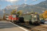 Re 4/4'' 11155 mit EC begegnet Re 6/6 11646 in Landquart.