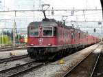 SBB Cargo - Re 6/6 11623 + Re 4/4 + Re 6/6 + Re 4/4 vor Gterzug bei der Durchfahrt im Bahnhof von Thun am 20.06.2009