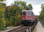 SBB: Güterzug mit der Re 6/6 11657  ESTAVAYIER-LE-LAC  bem Passieren der Emmenbrücke Biberist am 8.