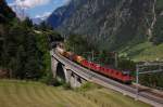 Re 6/6 11615 mit einer Re 4/4 und einem Rangiertraktor mit Gterzug am 27.06.2011 bei Wassen