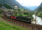 Eine Re 10/10 mit einem Gterzug am 26.08.2008 unterwegs bei Wassen.