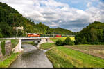 Am 31.07.2021 ist BLS Stiftung Ae 6/8 205 unterwegs mit einem Extrazug von Vallorbe nach Bern und konnte hier auf der neuen Brücke bei Moudon aufgenommen werden.