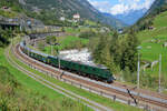 Gotthard-Bahntage: Ae 8/14 11801 mit einem Extrazug bei der Bergfahrt nach Göschenen unterhalb der Kirche von Wassen.