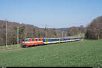 Re 4/4 II 11108 bringt am 29. März 2019 einen Extrazug für Militärangehörige, bestehend aus einem HVZ-Pendel der Regio-S-Bahn Basel, von Basel nach Bure. Hier zu sehen auf der ausschliesslich Militärtransporten dienenden Strecke Courtemaîche - Bure. 